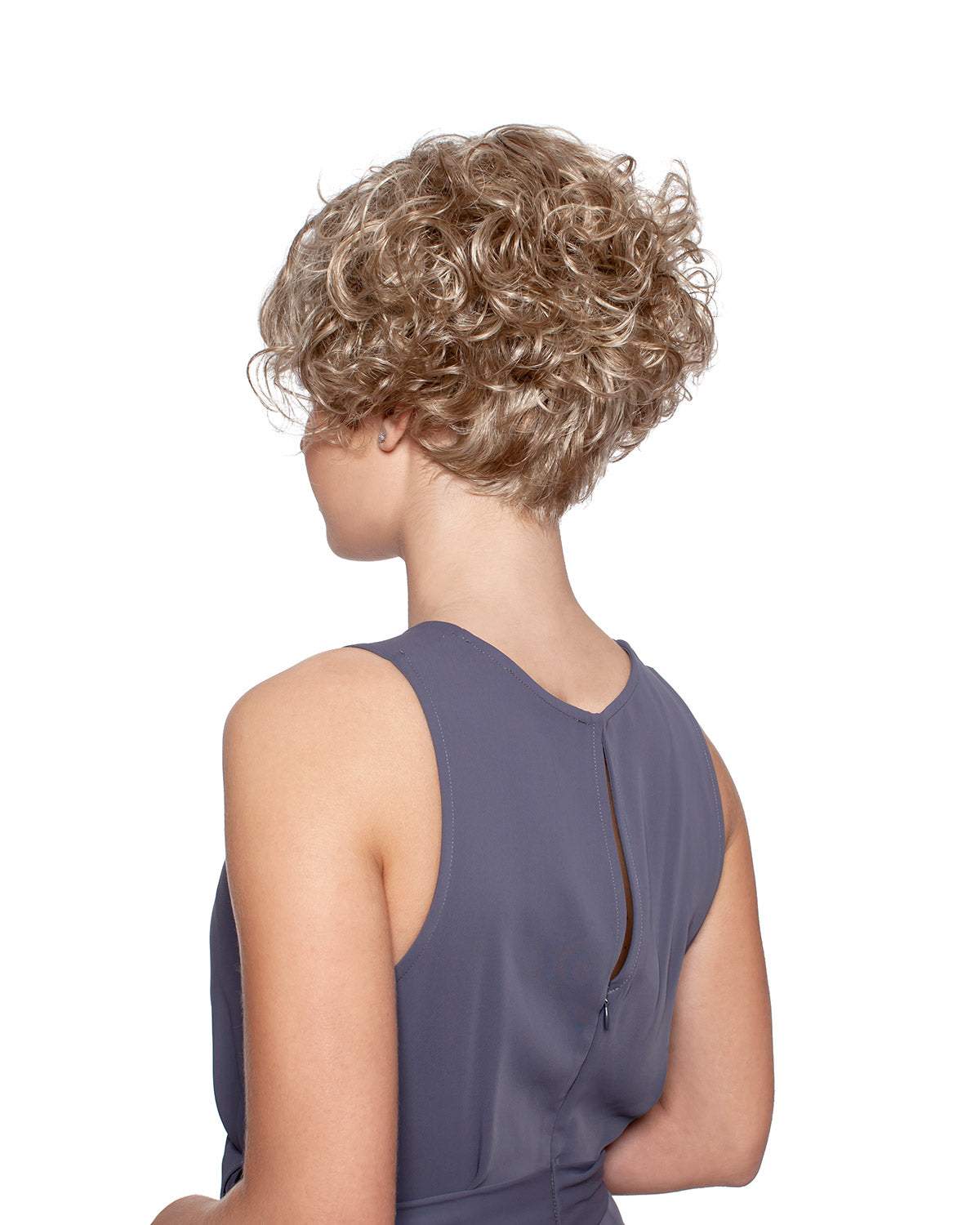 Woman wearing Annie synthetic curly wig by WigPro and a grey sleevelss top against a white background - back view