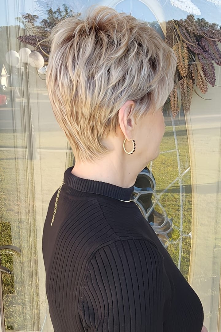 Woman wearing short pixie style (Rin by Noriko in color Seasalt Blonde)