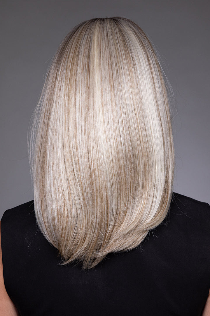 Back view of Adriana by Belle Tress synthetic layered bob wig in a highlighted blonde shade with soft, curved ends.