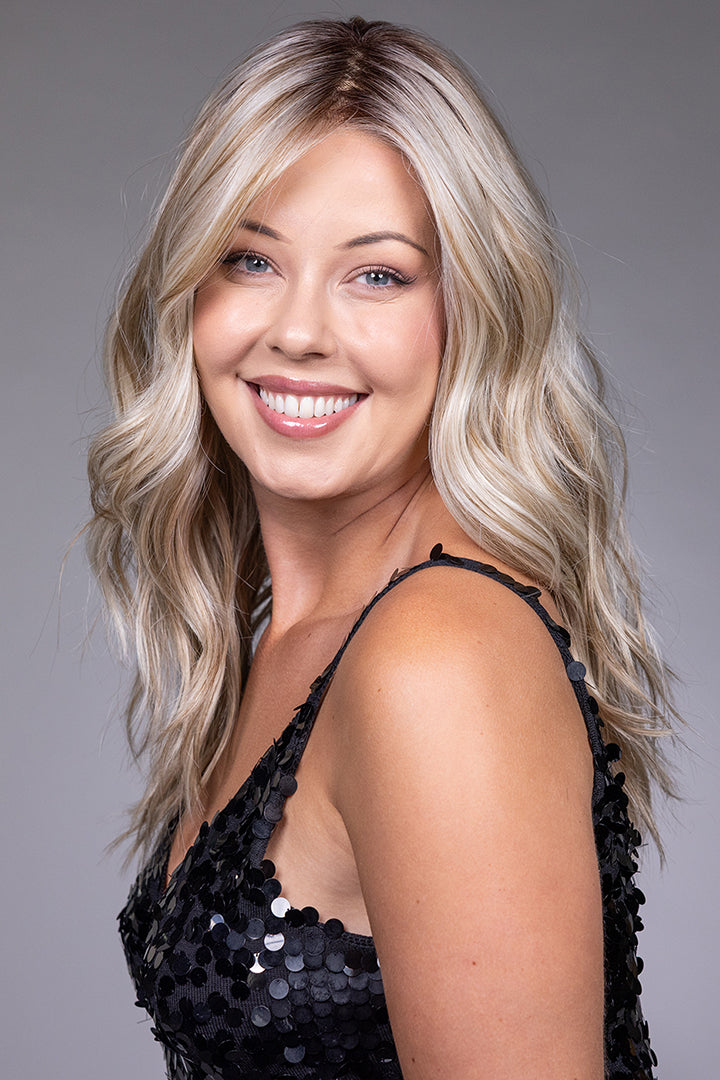Claudia by Belle Tress long blonde wavy heat-friendly synthetic wig with a natural lace front and monofilament top.
