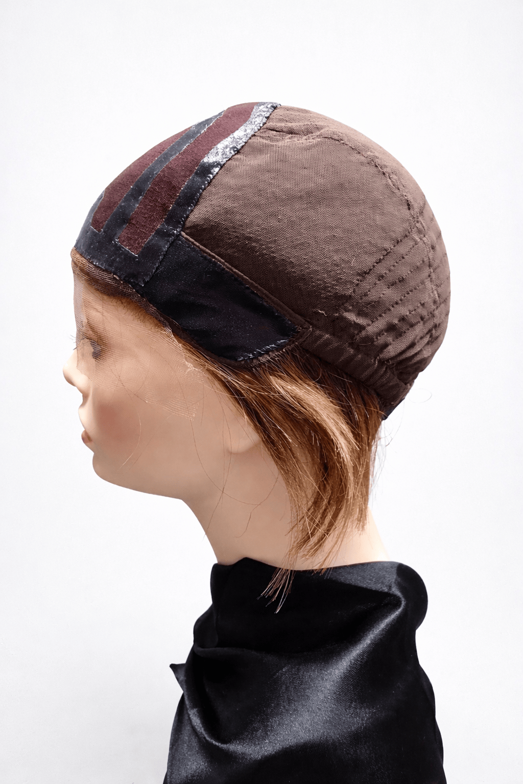 Emma cap construction with hand-tied wefting at nape