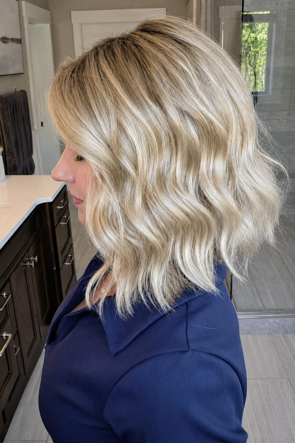 Woman wearing blonde wavy lob (Charlotte Hand-Tied by Envy in Prosecco).