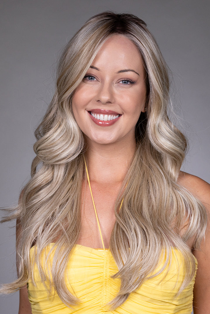 Gisele by Belle Tress long blonde wavy synthetic wig with a natural lace front and monofilament top.
