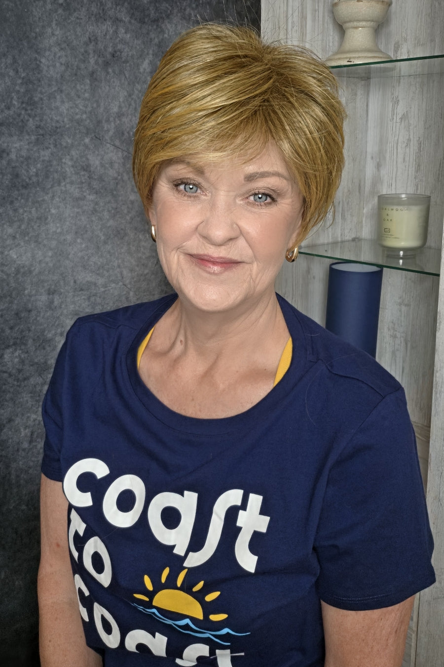 Woman wearing short pixie wig (Friendship by Gabor in color Dark Blonde).