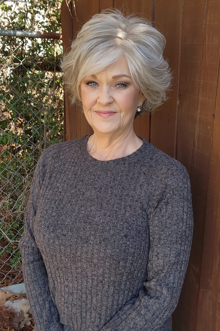 Woman wearing a cropped gray wig (Cutting Edge by Gabor in Iced Granita)