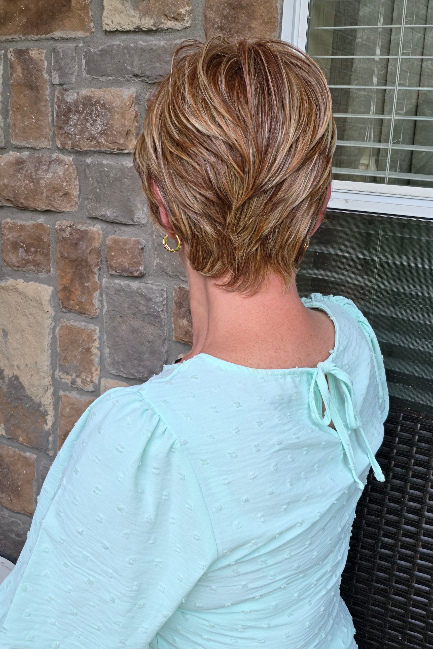 Woman wearing red pixie wig (Passion by Gabor in Light Red)