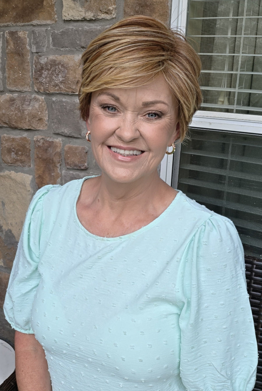 Woman wearing red pixie wig (Passion by Gabor in Light Red)