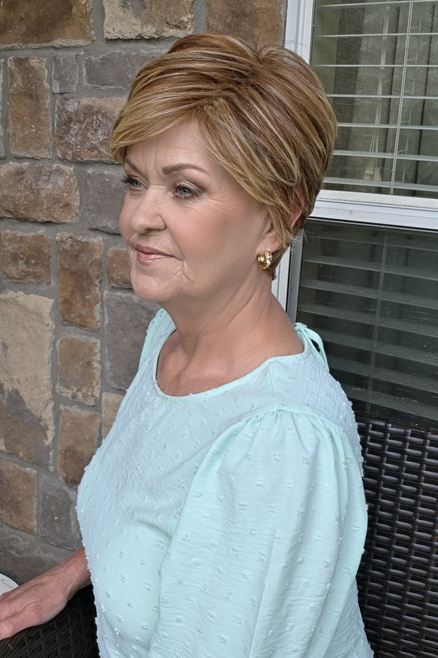 Woman wearing red pixie wig (Passion by Gabor in Light Red)