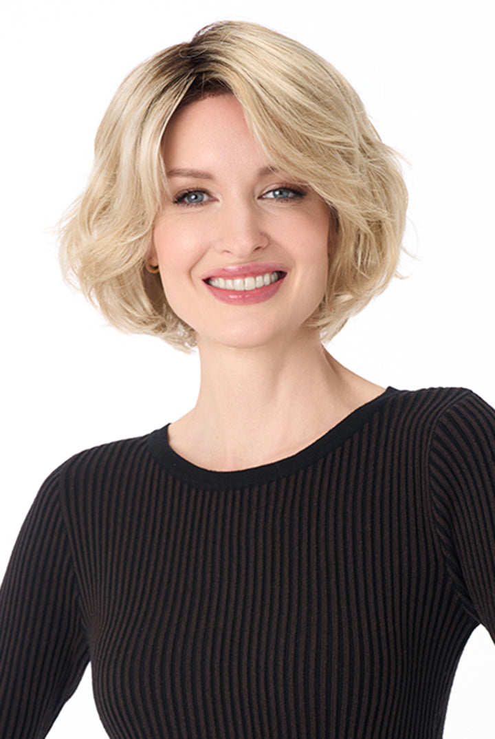 Gia by Envy synthetic chin-length blonde bob wig with textured layers and a modern, voluminous silhouette.