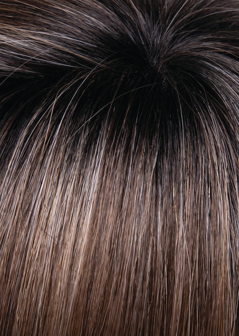 Close-up of dark brown hair with highlights