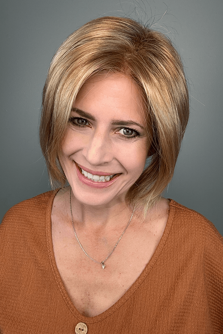 Woman wearing short angled bob cut blonde wig (Jon Renau's Idalia in 12FS8)