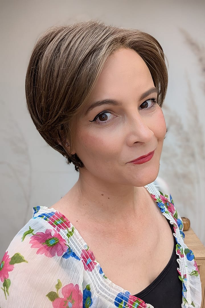 Woman with ear-length bob wig (Ivy by Jon Renau in 8RH14)