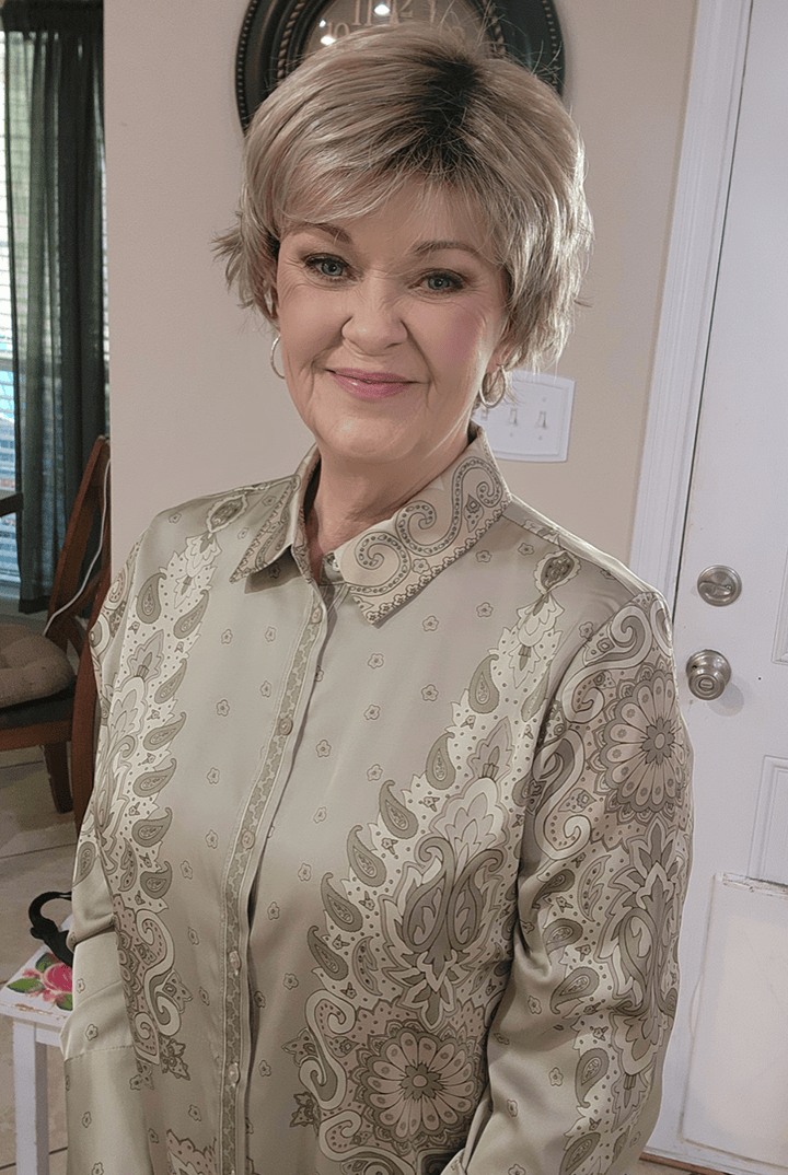 Woman wearing cropped pixie wig (Jon Renau's Chelsea in color Shaded Praline)