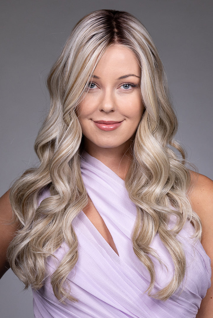 Karenina by Belle Tress long blonde wavy synthetic wig with a natural lace front and monofilament top.