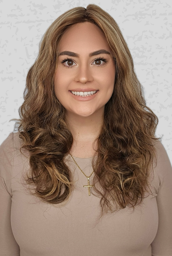 Woman with long, wavy hair wearing a 16-24 inch Bespoke wig from PUSH Hair in color Belle