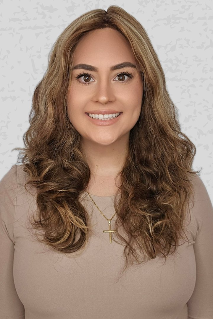 Woman with long, wavy hair wearing a 16-24 inch Bespoke wig from PUSH Hair in color Belle