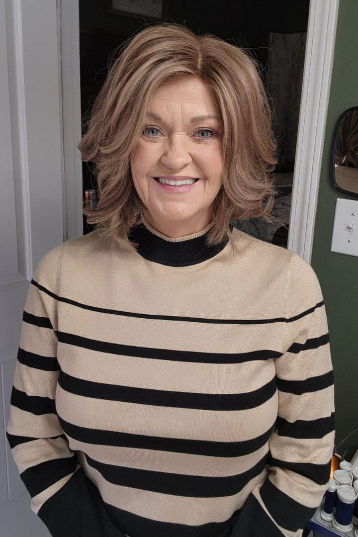 Alicia is wearing Genevieve Human Hair Wig in color Belle Cream - Front view