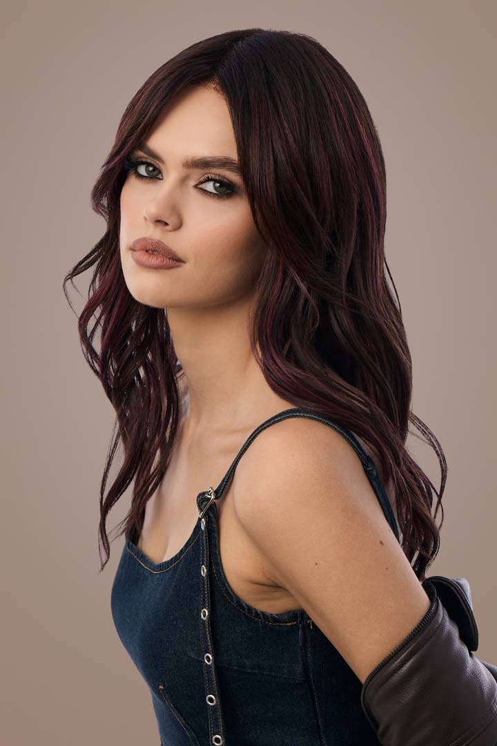 Woman with Posh Wavez Deep Plum Brown Wig