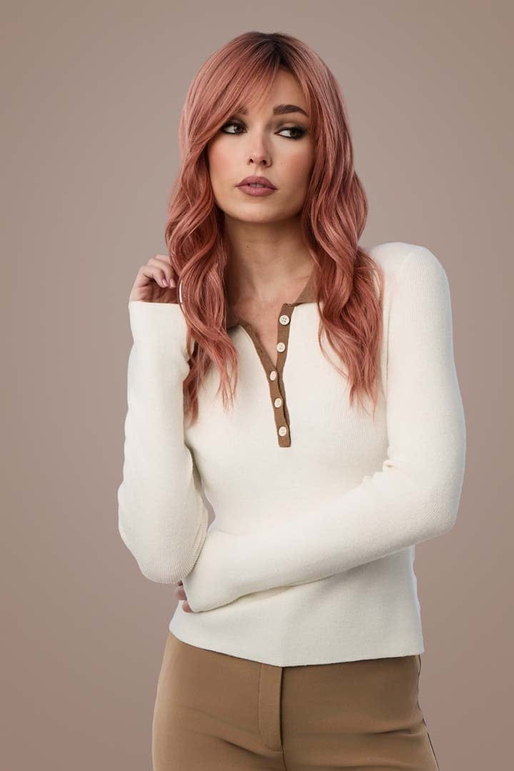 Woman in Posh Wavez Dusty Rose wig