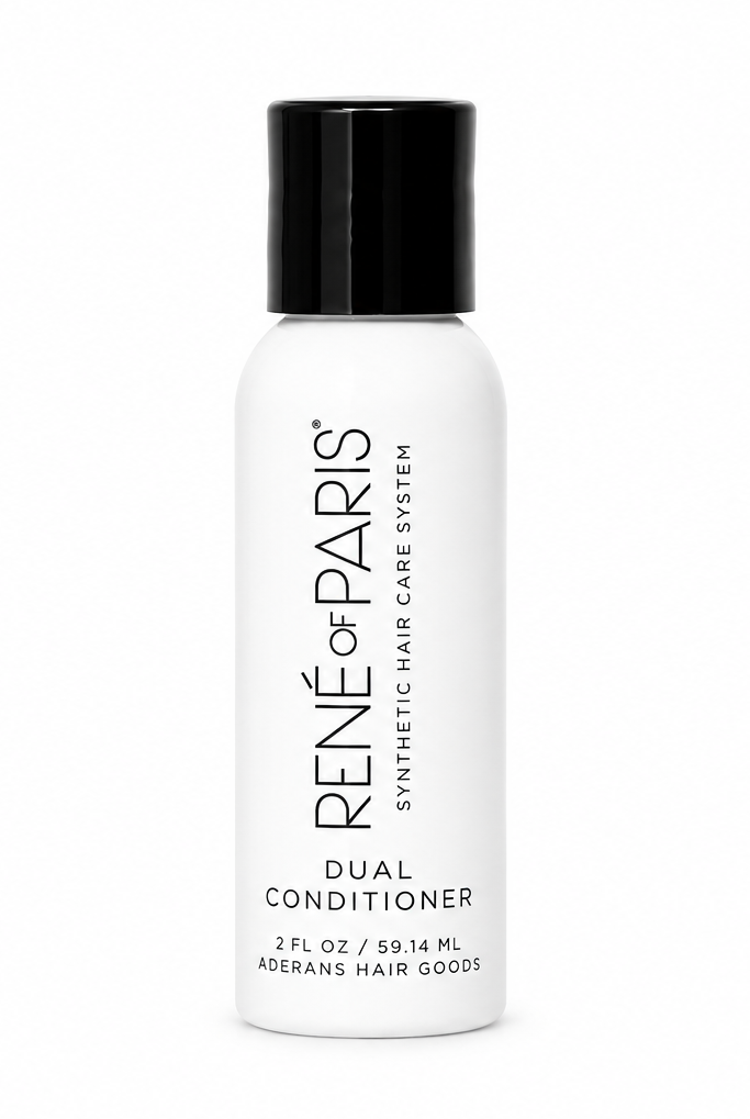 A white bottle of René de Paris Dual Conditioner with a black cap, centered on a plain white background.