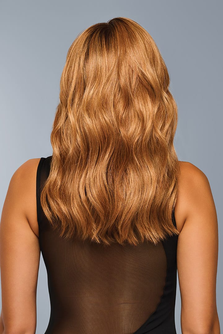 Woman is wearing Decadent Diva wig by Raquel Welch in color RL29/33SS | Back