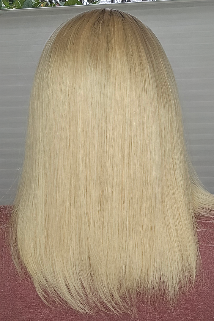 Blonde wig with a neutral background