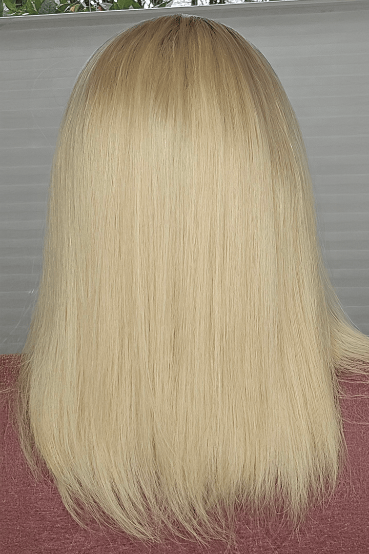 Blonde wig with a neutral background