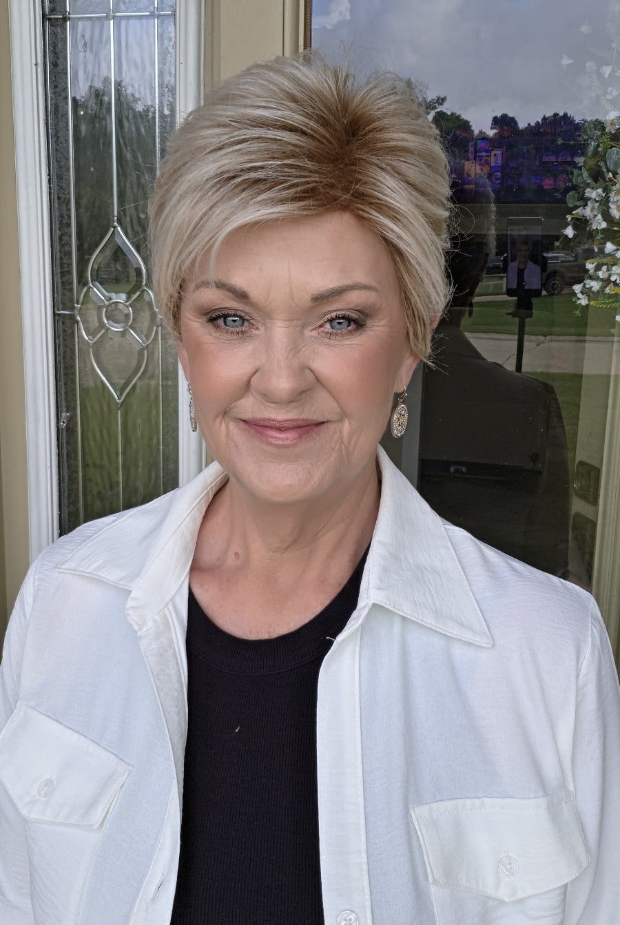 Woman with short blonde pixie wig (Angelic by Toni Brattin in Platinum)