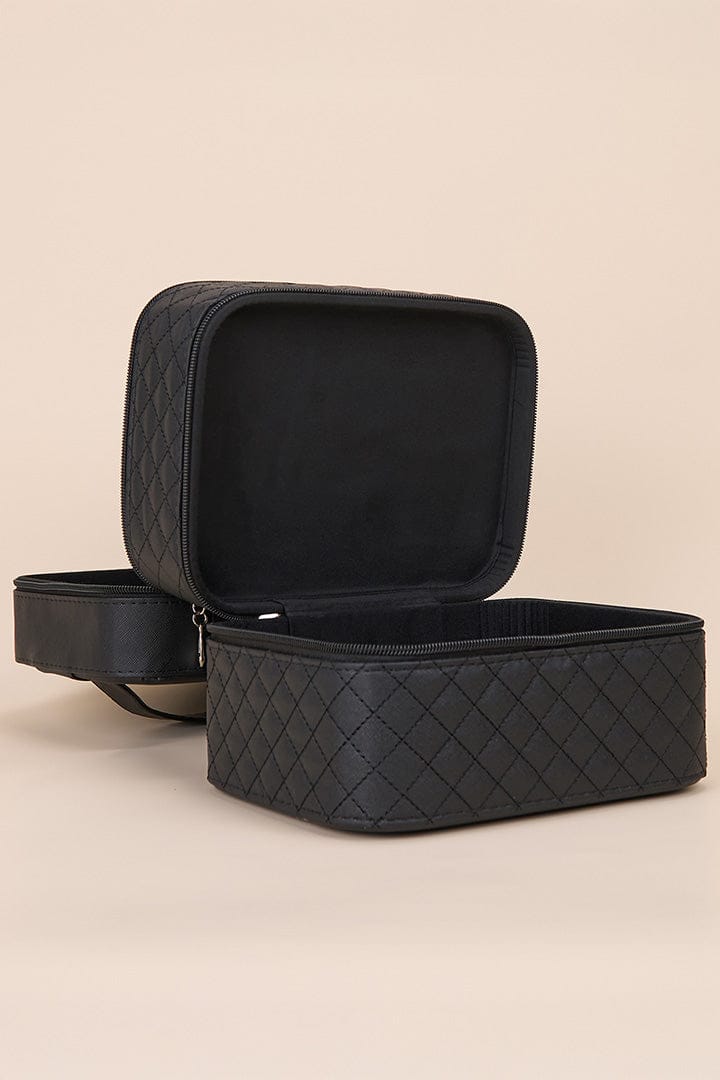 Open black quilted travel case