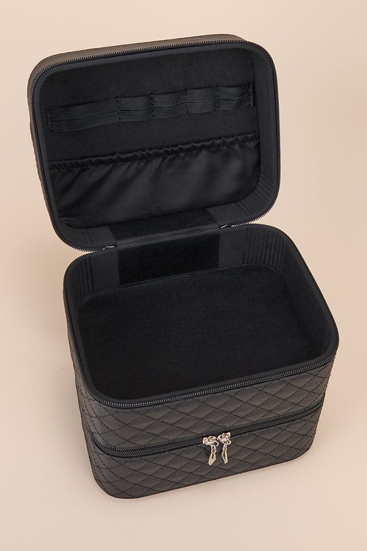 Black quilted travel case, open.