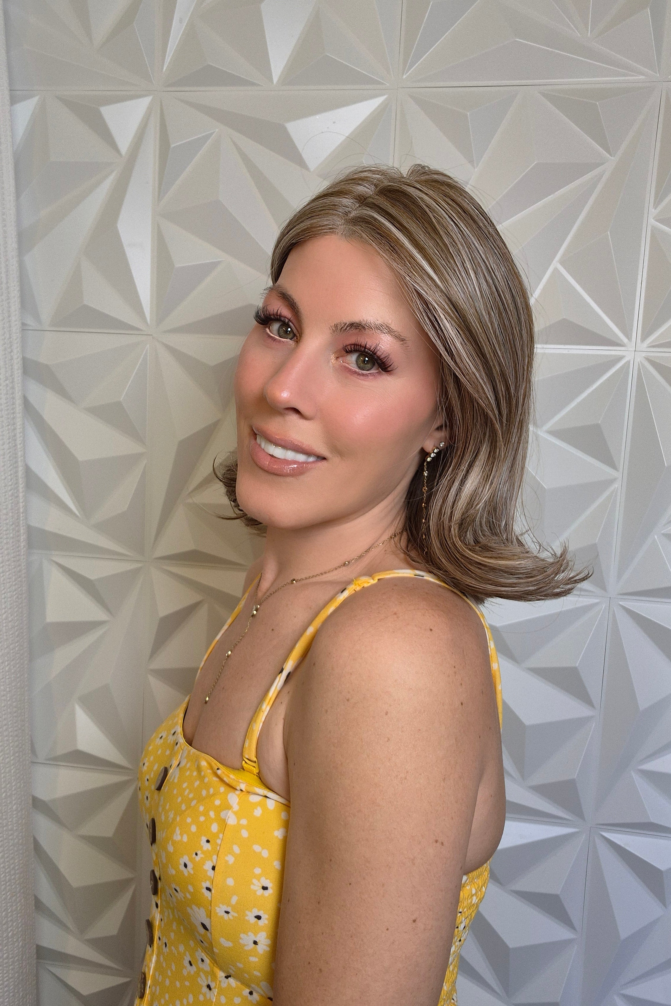 Woman wearing bronde lob wig (Harper by WigPro in 17/101)