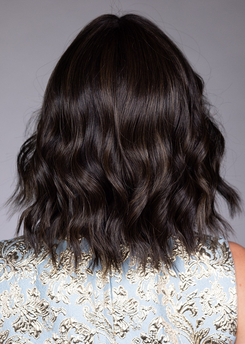 Woman wearing Zurich wig by Belle Tress in Triple Chocolate R | Back
