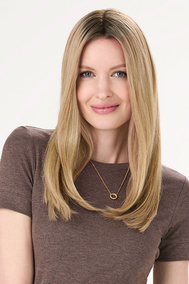 Model is wearing Barely There Straight Hair Topper by Envy 16" in color Blondie