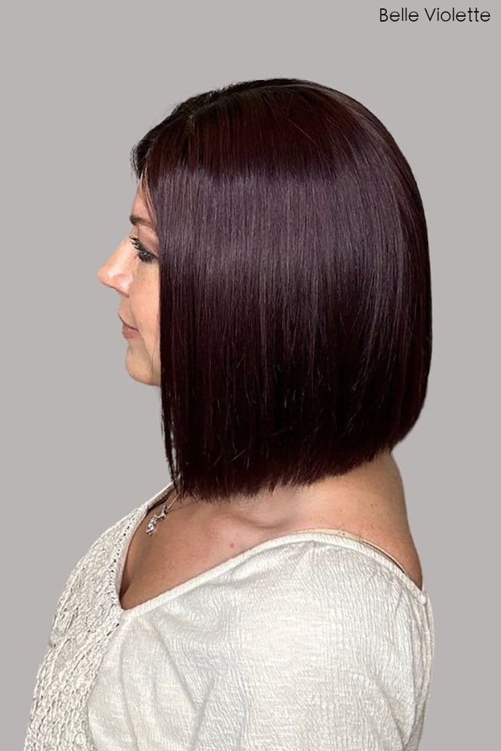 Christi is wearing Genevieve Human Hair Wig in color Belle Violette - Side view