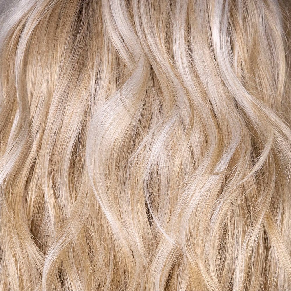 Biscotti Crème Rooted | A dimensional blonde with medium-to-dark blonde roots blending into a warm biscotti base and creamy golden-beige highlights. natural, sunlit tones create a chic, sophisticated look that mimics natural hair growth.