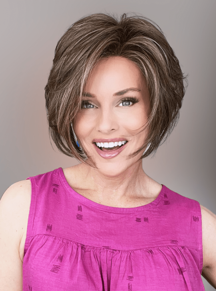 Woman wearing Ignite Lace Front Wig by Jon Renau with Fuchsia Colored Blouse