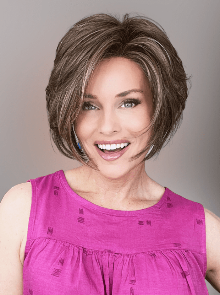 Woman wearing Ignite Lace Front Wig by Jon Renau with Fuchsia Colored Blouse