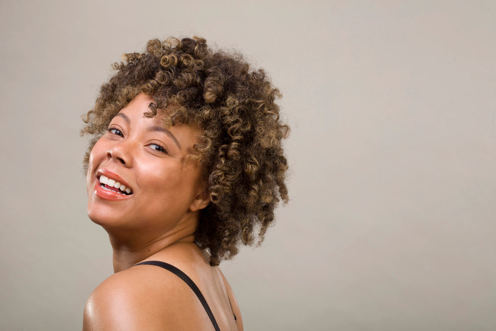 African American woman with short curly hair