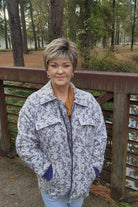 Woman wearing short pixie with bangs (Raquel Welch's Winner Premium in SS12/22)