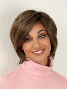 Woman wearing chin-length brunette bob wig (Juliet by Envy in color Macchiato)