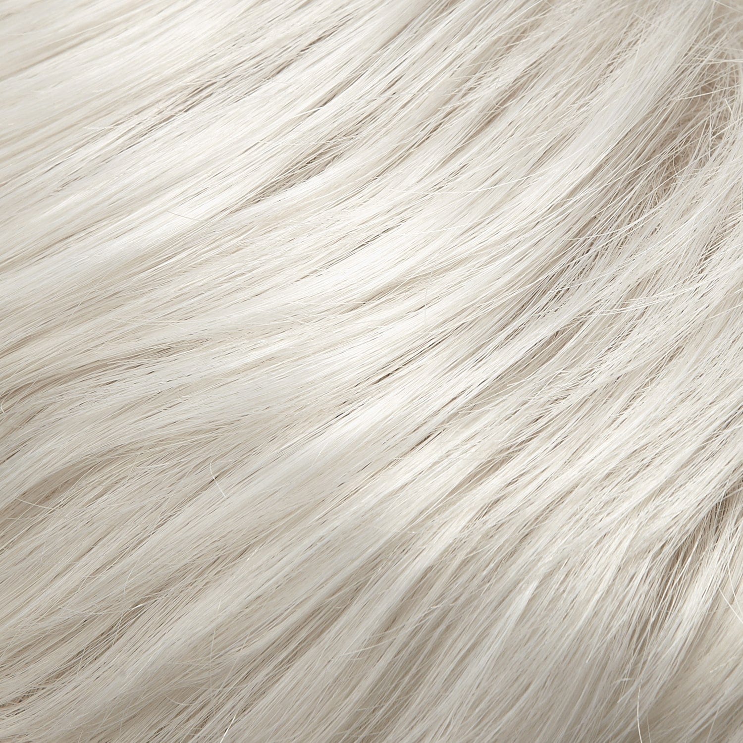 Close-up of white, wavy hair strands.