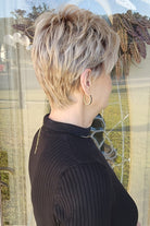 Woman wearing short pixie style (Rin by Noriko in color Seasalt Blonde)