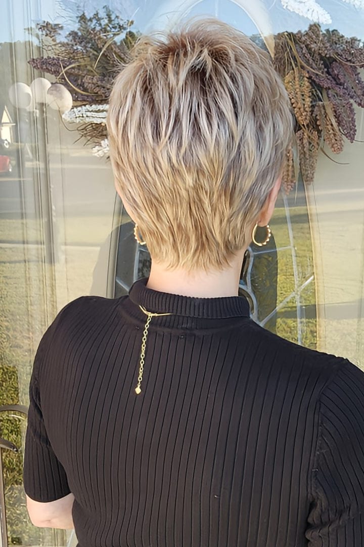 Woman wearing short pixie style (Rin by Noriko in color Seasalt Blonde)