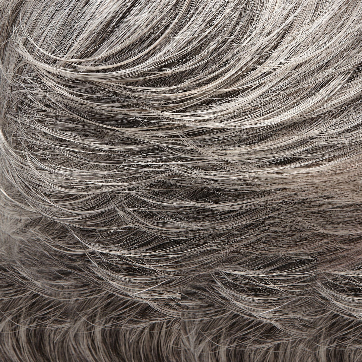 Close-up of wavy, gray hair.