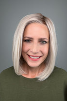 Woman wearing a shoulder length straight blonde bob (Amelie by PUSH Hair in color Roca Margarita Blonde).