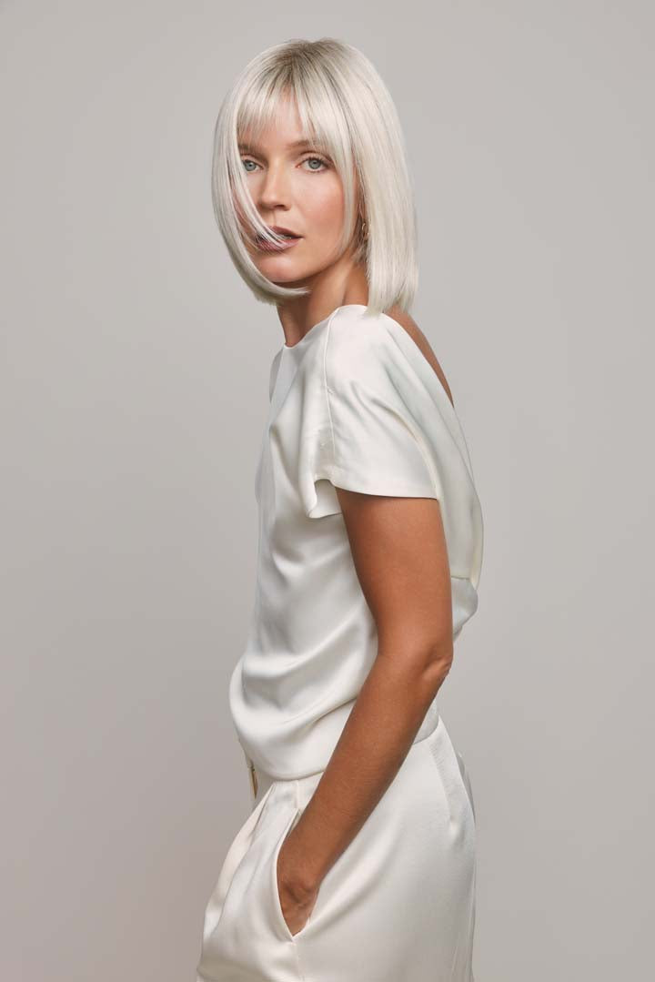 Ami by Noriko synthetic lace front bob wig in a sleek, platinum blonde shade with face-framing layers.
