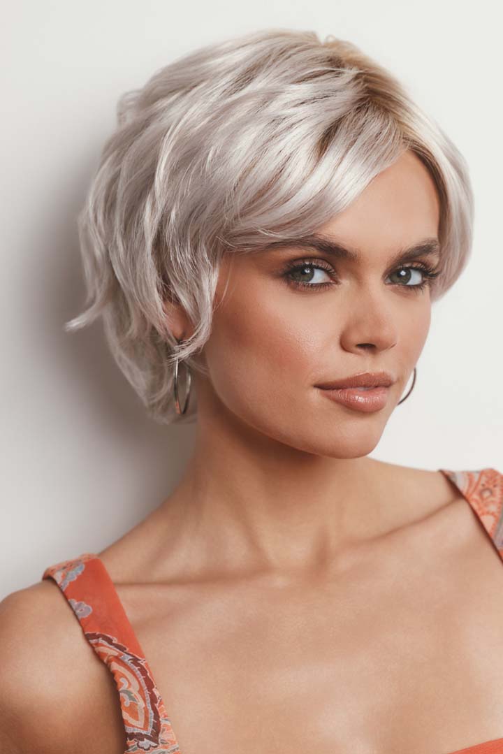 Asha synthetic pixie wig in platinum blonde with a lace front, side-swept fringe, and textured layers.