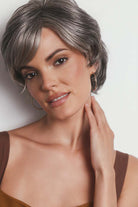 Asha synthetic pixie wig in a salt-and-pepper grey with a lace front, side-swept fringe, and textured layers.