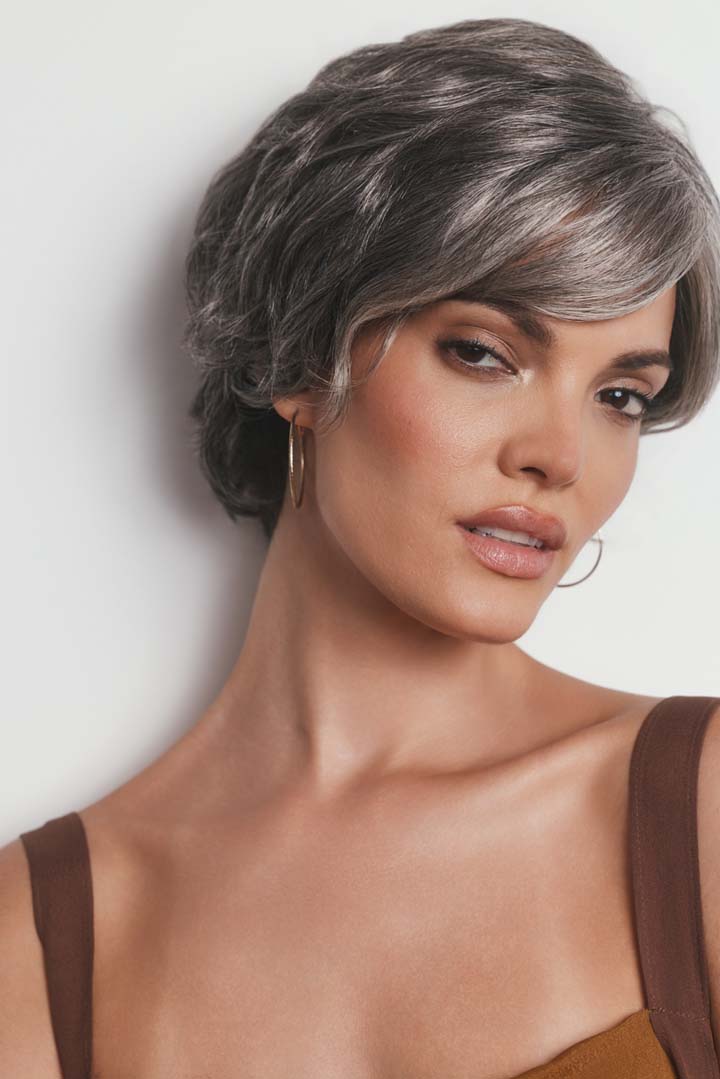 Asha synthetic pixie wig in a grey-toned color with a lace front, side-swept fringe, and textured layers.