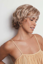 Asha synthetic pixie wig in blonde highlights with a lace front and textured, side-swept layers.